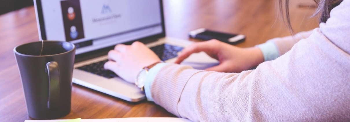 Woman typing on a laptop