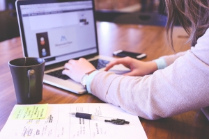 Woman typing on a laptop