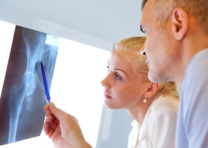 Two Orthopedic Nurse Practitioners Examining X-rays