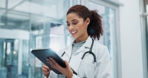 African-American medical professional using a tablet